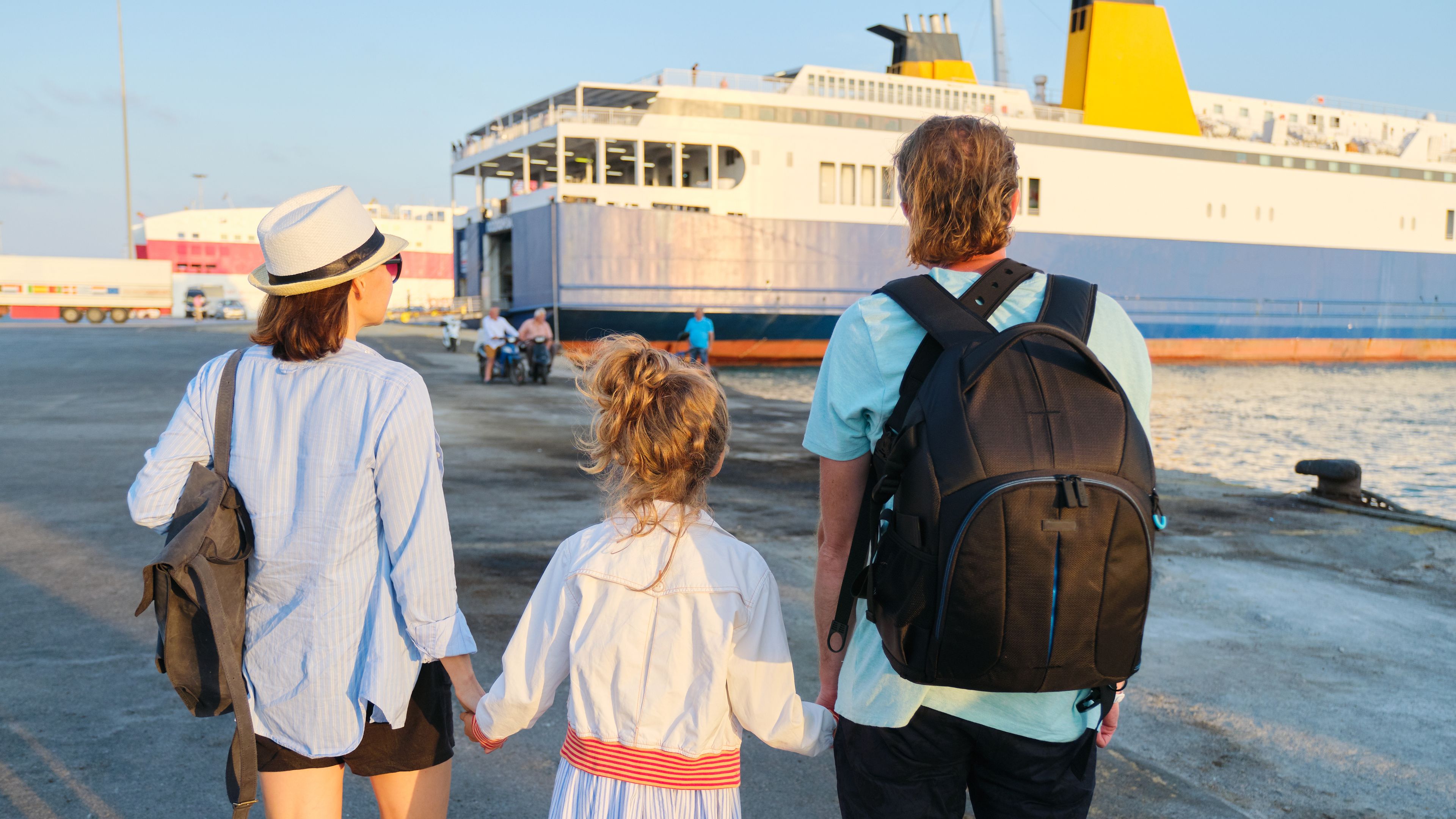 A family walking towards a cruise