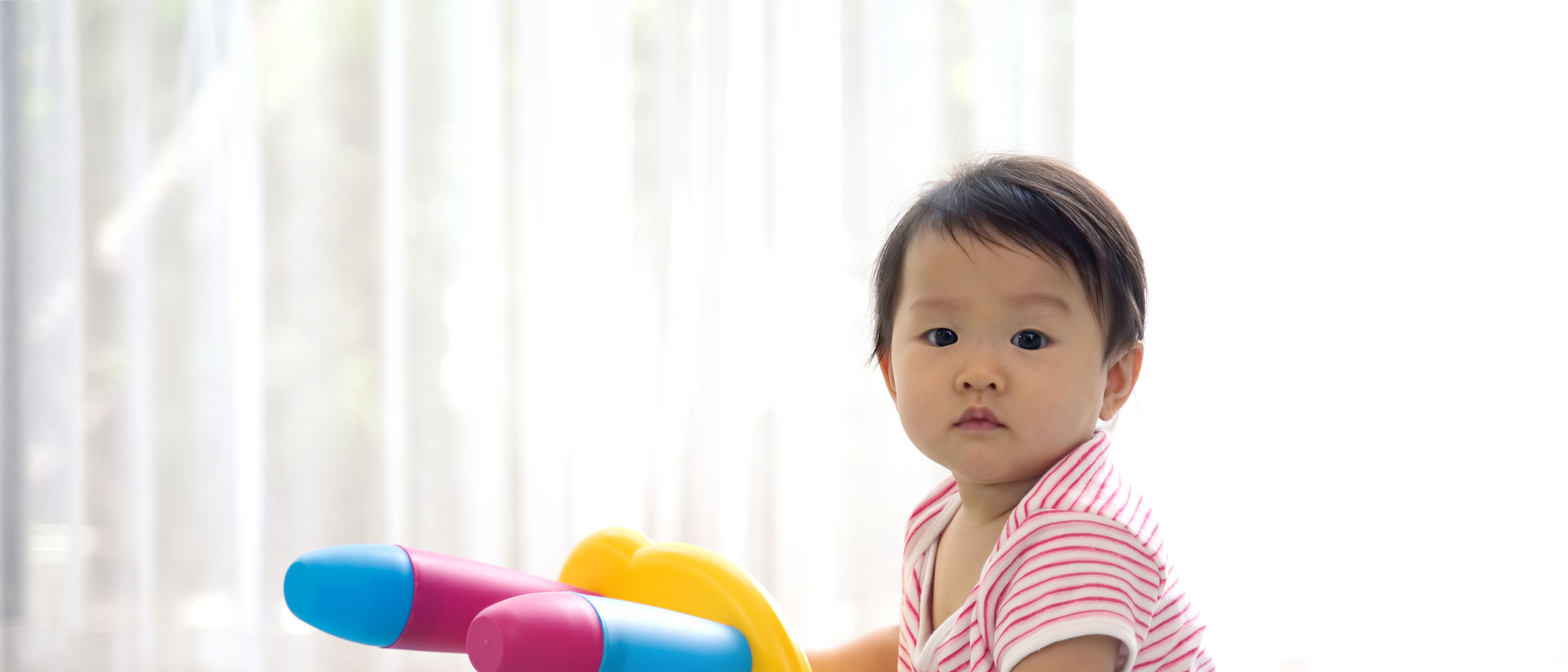 Baby playing with chair