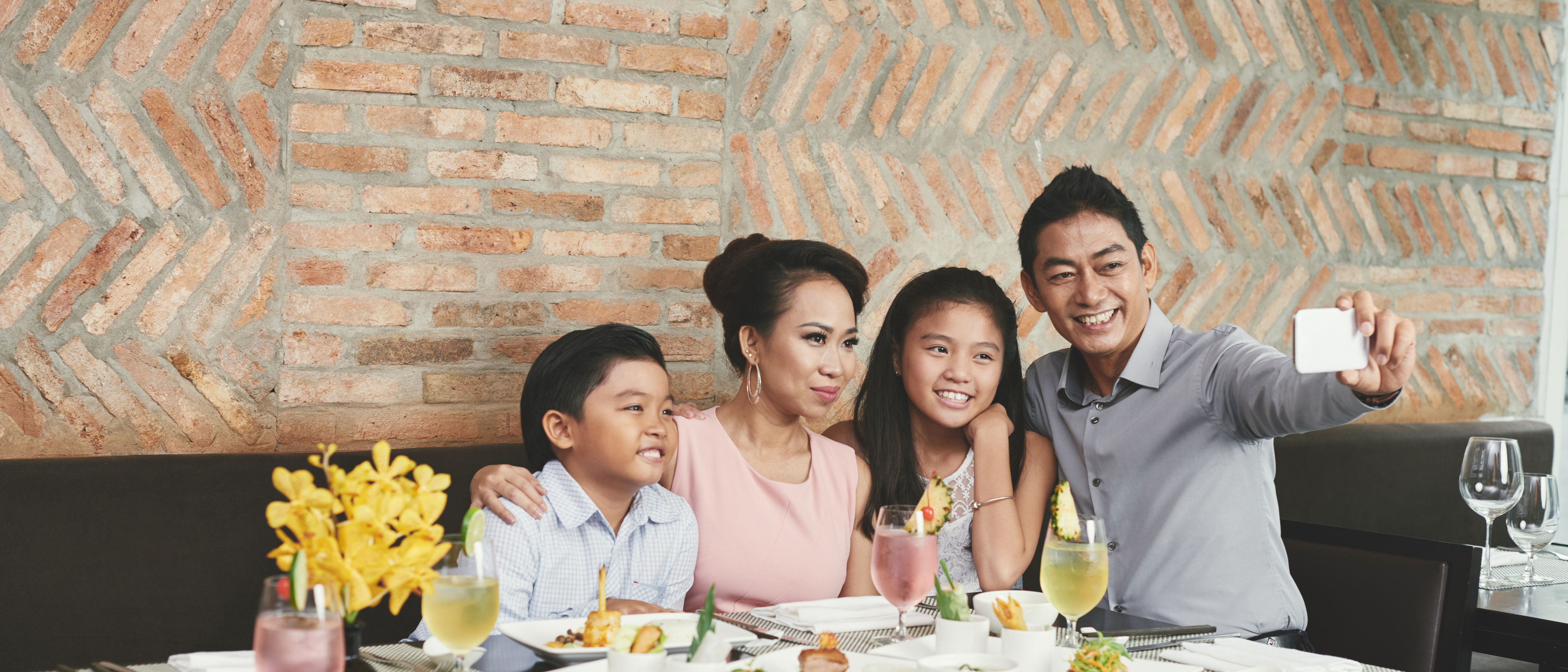 Malaysian family enjoying in a restaurant.