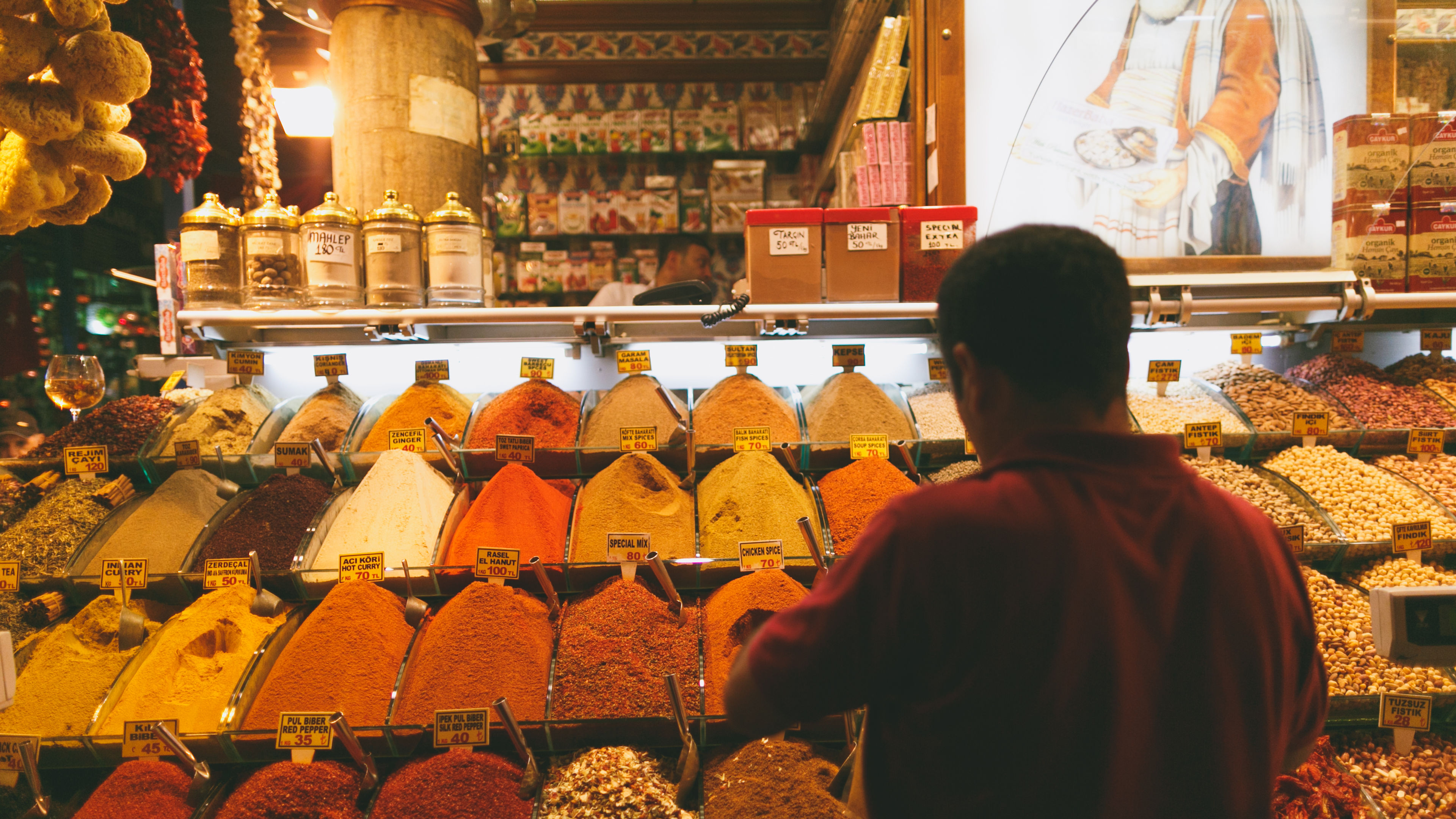 Man choosing various spices from the market 