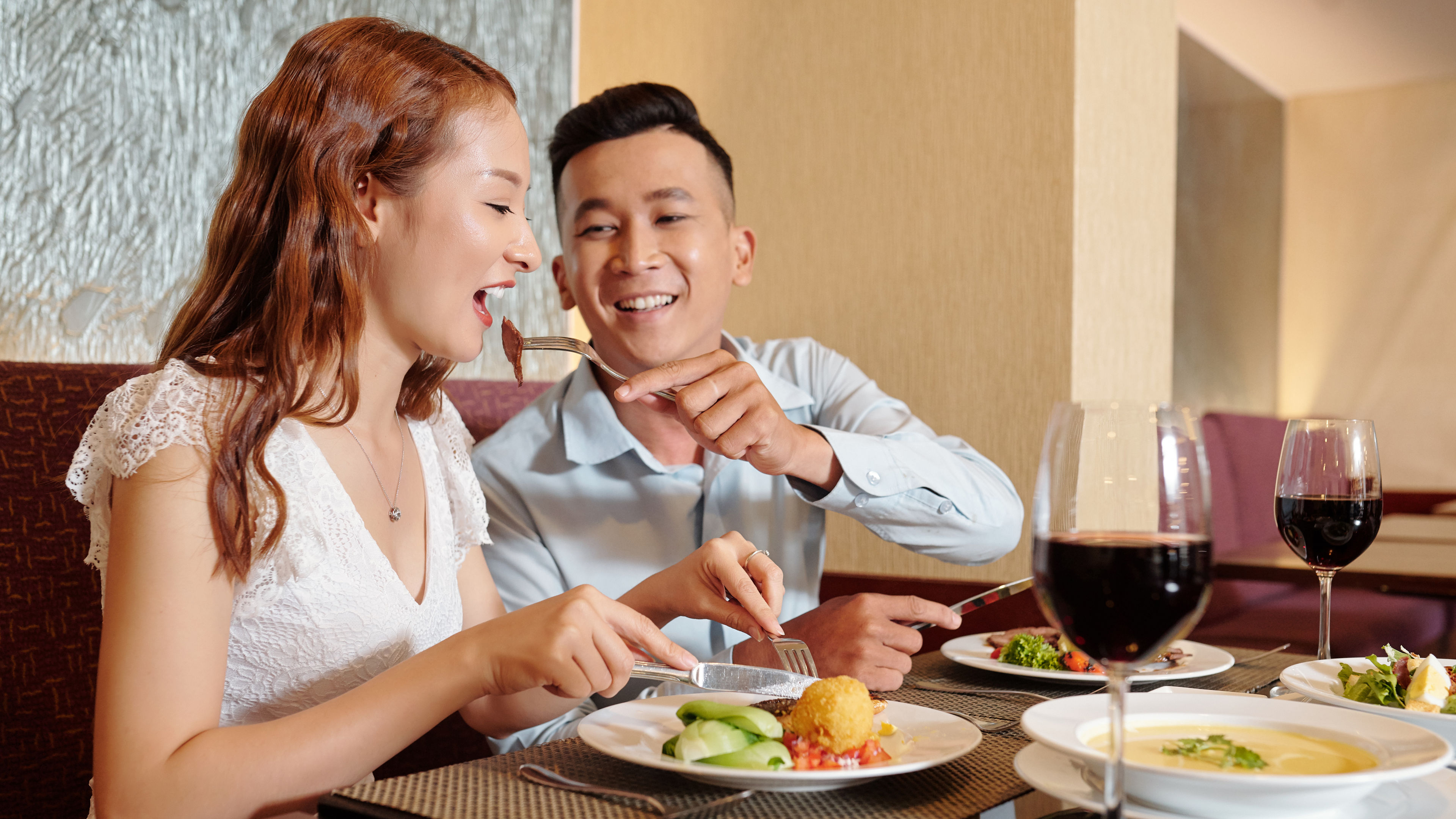 Man feeding his girlfriend